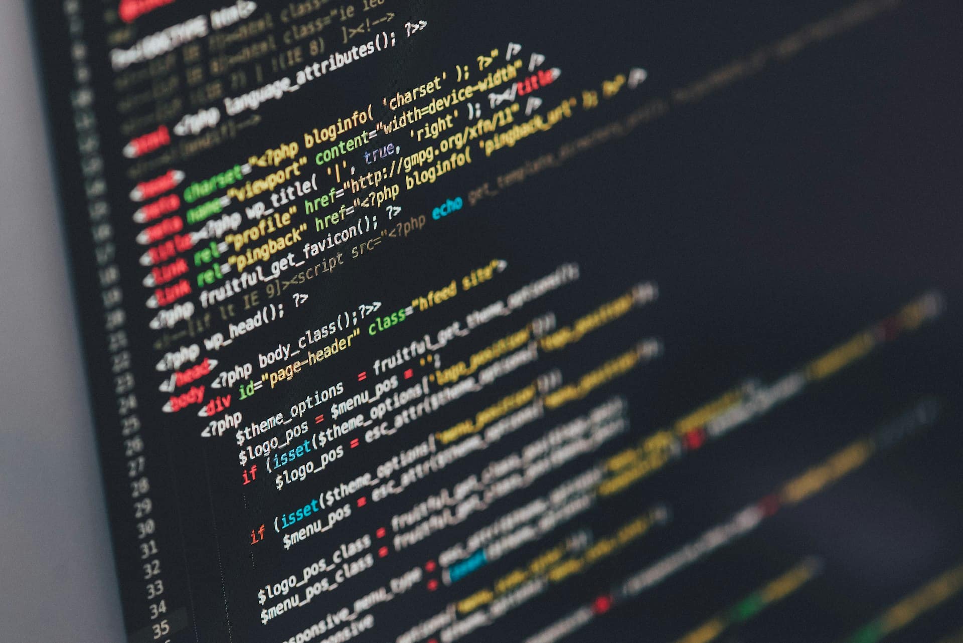 Laptop with code editor open on a desk