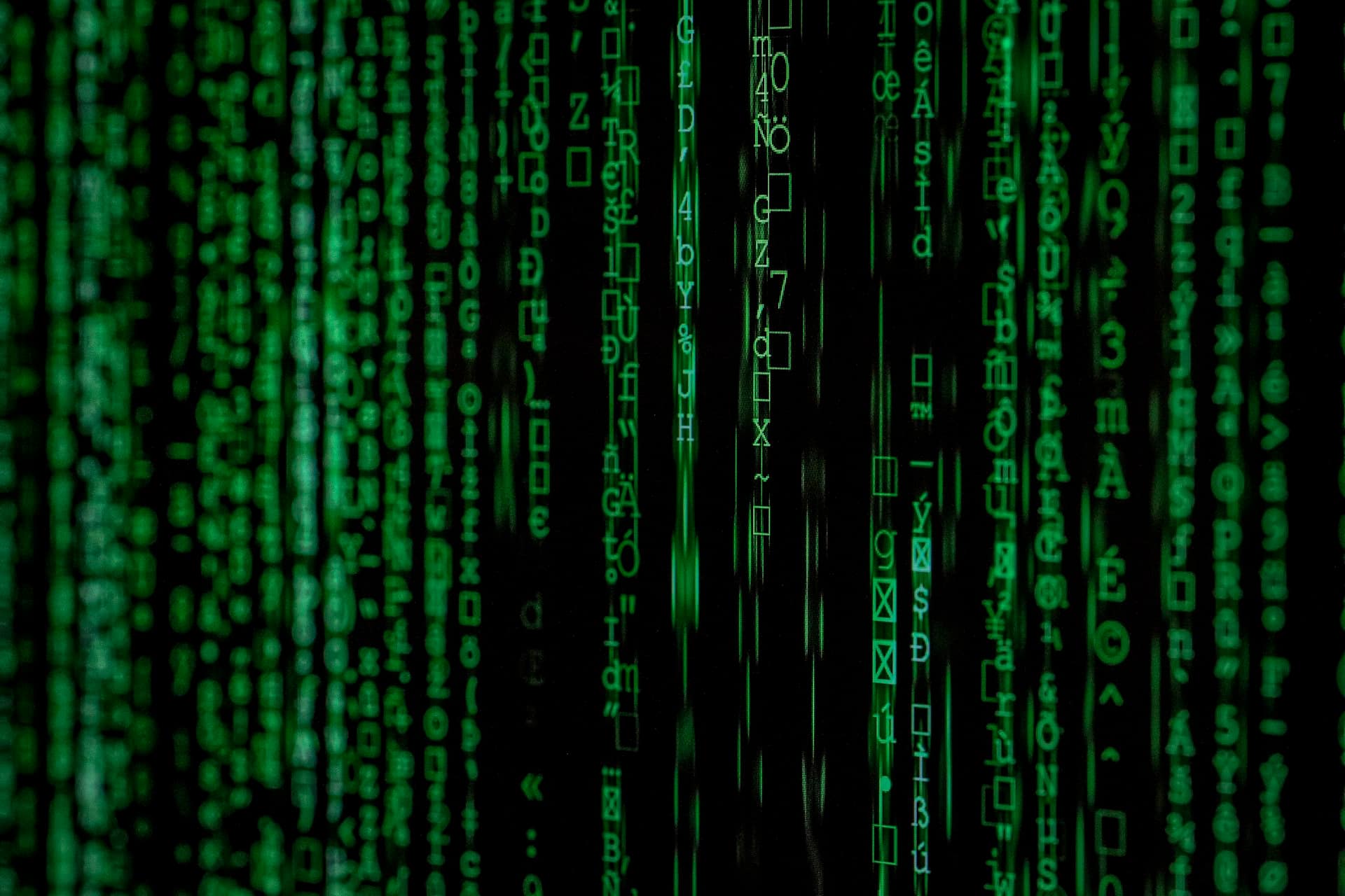 Green matrix code on black screen